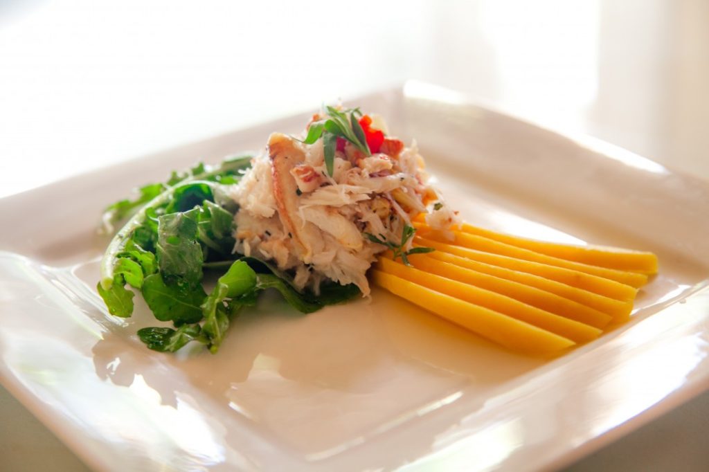 crab salad on a plate with fresh vegetables
