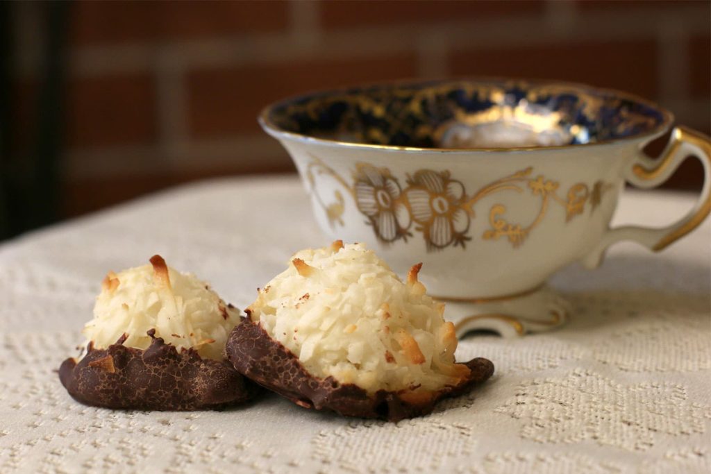 Two Coconut Macaroons with a cup of tea