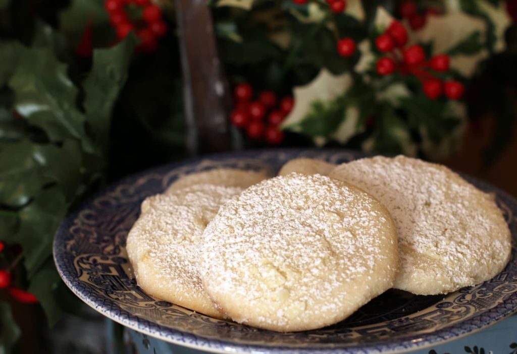 Plate of sugar cookies dusted with powdered sugar